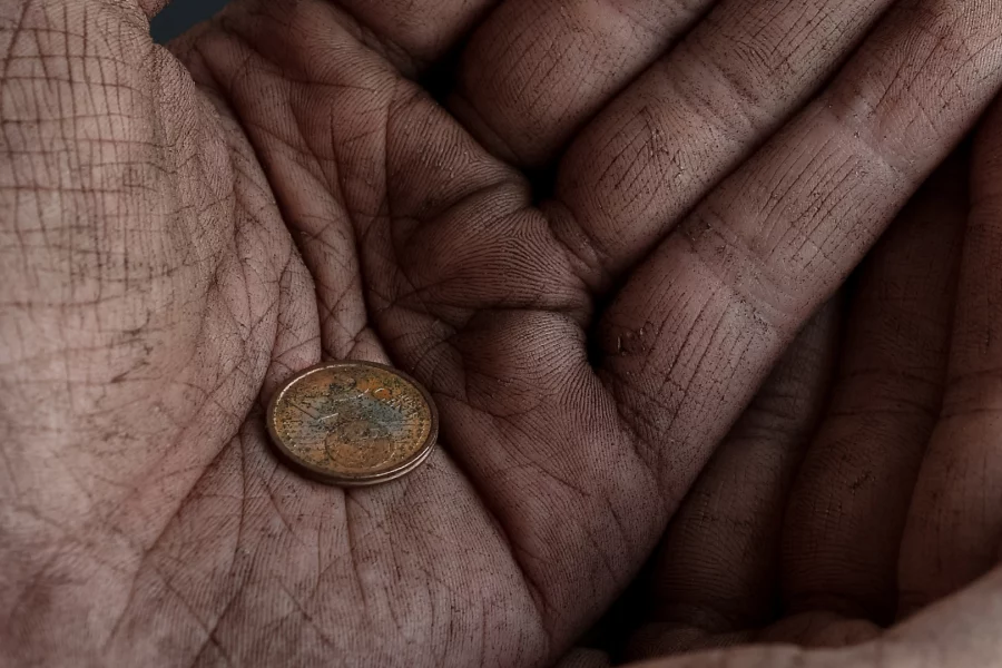 old_hands_with_coin